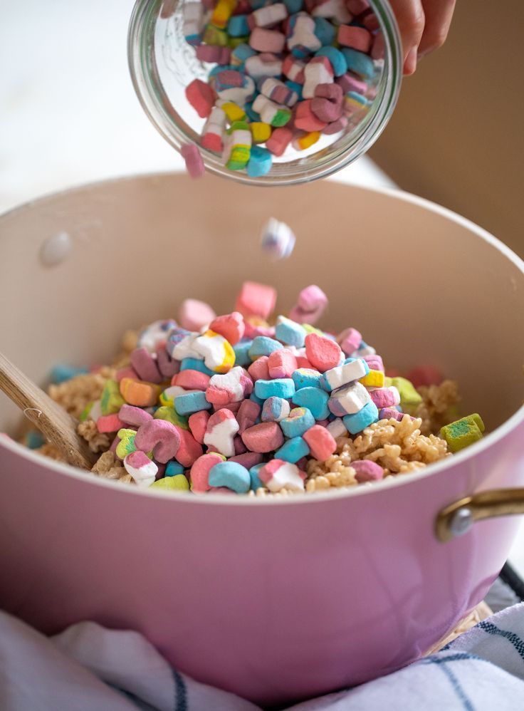 a bowl filled with cereal and marshmallows