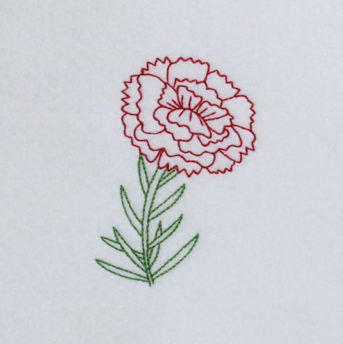 a red and white flower with green stems on a white sheet that has been embroidered onto