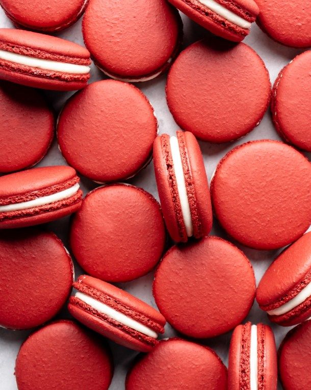 red macaroons with white stripes on them