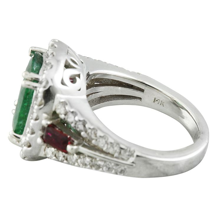 Stamped: 14K Total Ring Weight: 9 Grams Emerald Weight 3.80 Carat (11.60x9.00 Millimeters)Ruby Weight 0.40 Carat (4.20x2.20 Millimeters)Diamond Weight: 1.00 carat (F-G Color, VS2-SI1 Clarity )Face Measures: 15.30x13.70 Millimeter SKU: [600637] 14k White Gold Diamond Ring, Gold Diamond Ring, White Gold Diamond Rings, White Gold Diamonds, Gold Diamond, Diamond Ring, Emerald, Ruby, White Gold