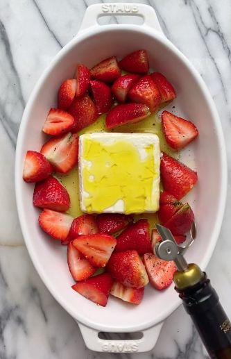 strawberries in a bowl with butter and syrup