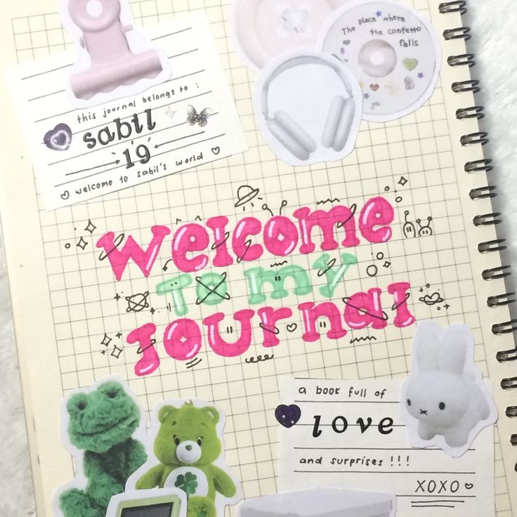 an open notebook with stickers on it and the words welcome to my journey written in pink