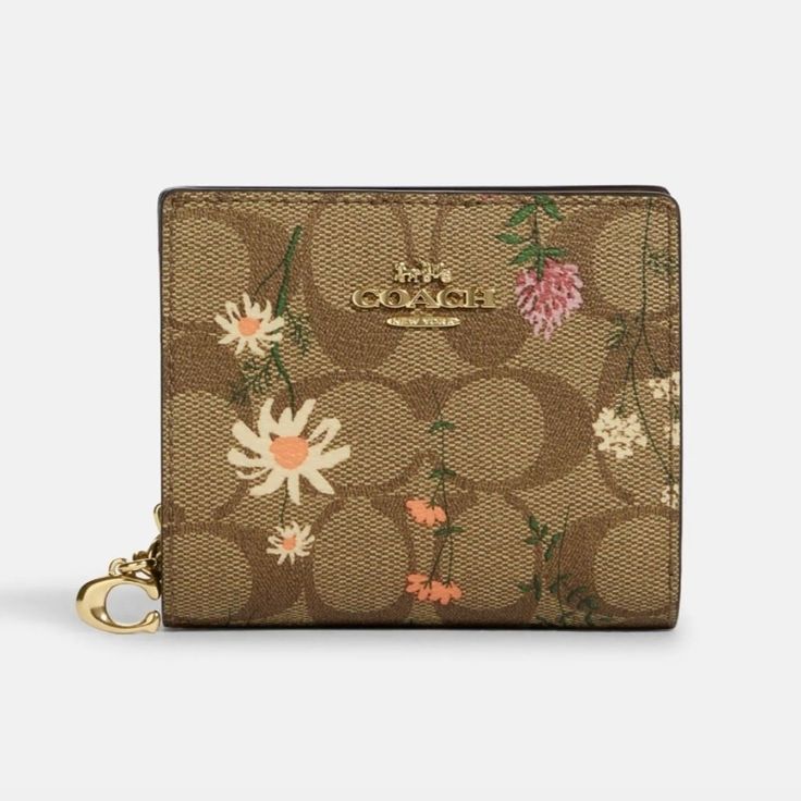 Coach Wallet In Signature Canvas With Wildflower Print Signature-Coated Canvas And Smooth Leather Three Credit Card Slots Id Window Full-Length Bill Compartment Snap Closure Outside Zip Coin Pocket 4 1/4" (L) X 3 1/2" (H) X 1" (W) B1010 Spring Bags With Card Slots, Chic Spring Wallets, Coach Wallets As Spring Gifts, Elegant Wallets For Daily Use In Spring, Elegant Spring Wallets For Daily Use, Feminine Rectangular Wallet For Daily Use, Feminine Daily Use Rectangular Wallet, Beige Wallets For Spring, Elegant Rectangular Wallet For Spring