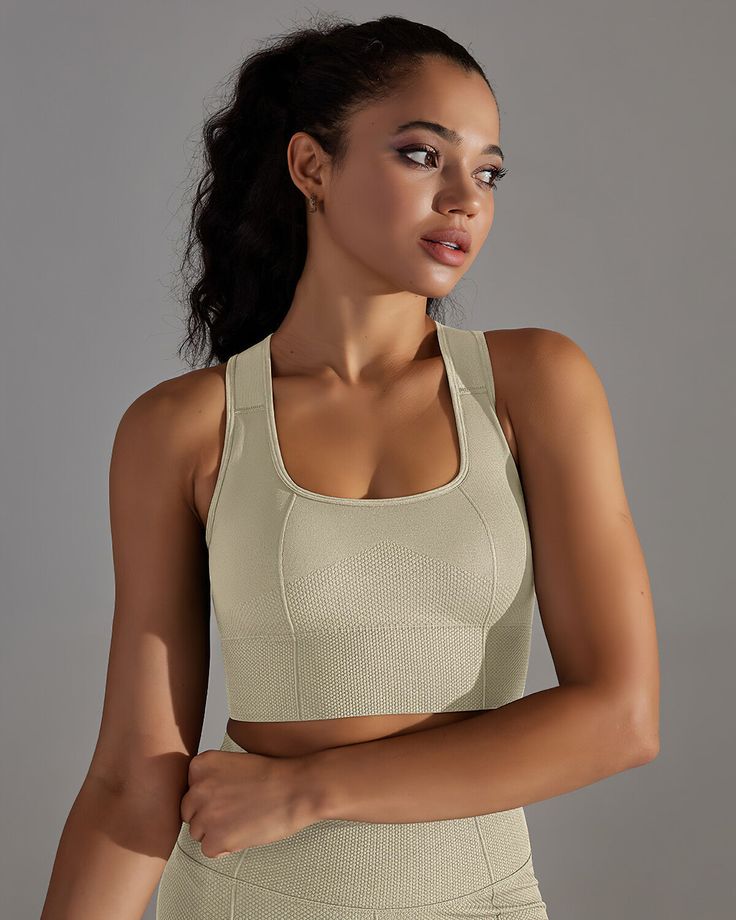 The Alodia Racerback Sports Bra, a beacon of style and strength, embodies the perfect fusion of form and function for the modern athlete. Crafted from premium knitted fabric, this sports bra envelops you in luxurious comfort and a soft, second-skin embrace that keeps you poised for peak performance, whether you're conquering the gym or embracing an active day ahead.With its sleek U-shaped neckline and racerback design, the Alodia Racerback Sports Bra not only delivers a fashion-forward look but also offers unparalleled support. Precision-contoured seams and panels ensure a flawless fit, guaranteeing it stays firmly in place during even your most demanding workouts. And thanks to its moisture-wicking and breathable technology, you'll stay cool, dry, and ready to take on any challenge with u Racerback Sports Bra, Peak Performance, Second Skin, The Modern, Moisture Wicking, Fashion Forward, Knitted Fabric, Sports Bra, Tie Dye