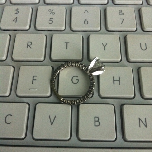 a ring sitting on top of a computer keyboard