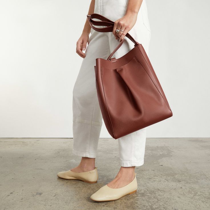 The Italian Leather Studio Bag Cocoa Brown – Everlane Modern Bucket Bag With Leather Handles For On-the-go, Workwear Bucket Bag With Detachable Strap, Workwear Crossbody Bucket Bag With Detachable Handle, Leather Crossbody Bags For Work, Modern Soft Leather Satchel For On-the-go, Workwear Bucket Shoulder Bag With Leather Handles, Workwear Leather Handle Bucket Shoulder Bag, Leather Handles Hobo Shoulder Bag For Work, Workwear Hobo Tote Bag With Detachable Strap