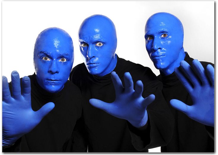 three blue men with their hands in the air