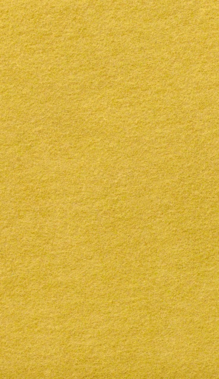 an airplane is flying in the sky over some yellow paper