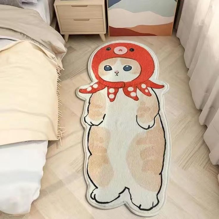 a teddy bear rug on the floor next to a bed