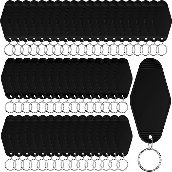 10 pairs of black plastic key chains with metal rings on each side and an oval ring at the end