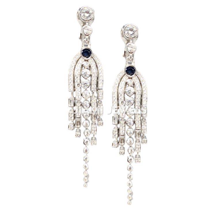 Enhance your elegance with these exquisite Blue Sapphire CZ Chandelier Tassel Drop Earrings. Crafted with attention to detail in 14k White Gold Finish 925 Sterling Silver, these English Lock Dangle earrings feature a unique design that is customized to perfection. The rich blue sapphire CZ stones add a touch of glamour, making them a statement piece for any occasion. these earrings are a stylish addition to any outfit. Materials: -925 Sterling Silver -Blue Sapphire CZ -CZ Diamond Care Instructio Art Deco Dangle Chandelier Earrings For Formal Occasions, Formal Art Deco Dangle Chandelier Earrings, Luxury Long Drop Chandelier Earrings For Formal Occasions, Luxury Long Drop Chandelier Earrings For Formal Events, Classic Chandelier Dangle Earrings With 17 Jewels, Exquisite Dangle Chandelier Earrings For Evening, Exquisite Chandelier Dangle Earrings For Evening, Formal Dangle Chandelier Earrings Clip-on, Formal Diamond Cut Dangle Chandelier Earrings