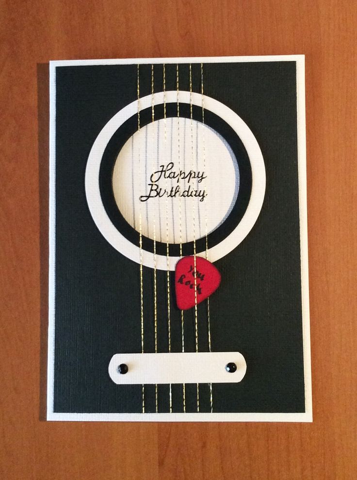 a happy birthday card with a guitar string and a red heart on the strings that says happy birthday