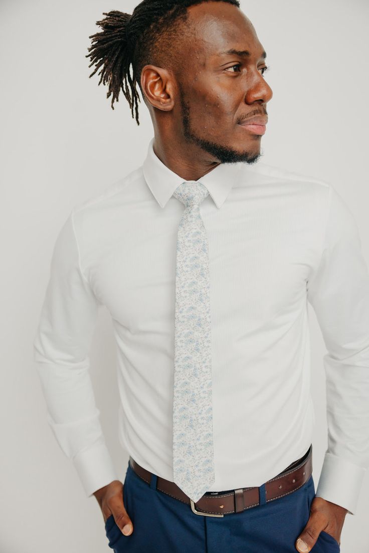 We pride ourselves in offering our customers some of the best skinny ties money can buy. Each DAZI tie is handmade from high quality imported fabrics. Features: Approx. 2.5" wide at the tip Approx. 58" in length 100% Cotton Dapper Fitted Standard Tie, Dapper Fitted Tie, Dapper Standard Tie, Dapper Fitted Neckwear For Semi-formal Occasions, Dapper Fitted Neckwear For Work, Fitted Standard Tie For Business, Semi-formal Fitted Standard Tie, White Business Ties, Suit And Tie Accessories For Semi-formal Summer Events