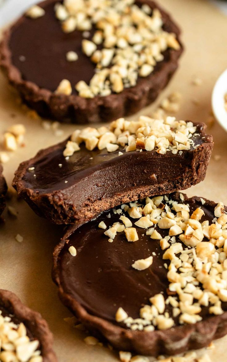 chocolate covered cookies with nuts and sprinkles