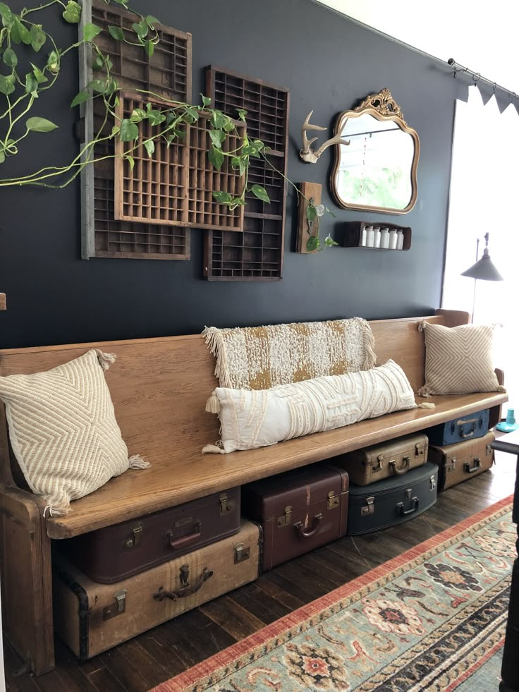 a wooden bench sitting in the middle of a living room