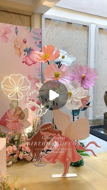 a table topped with lots of paper flowers