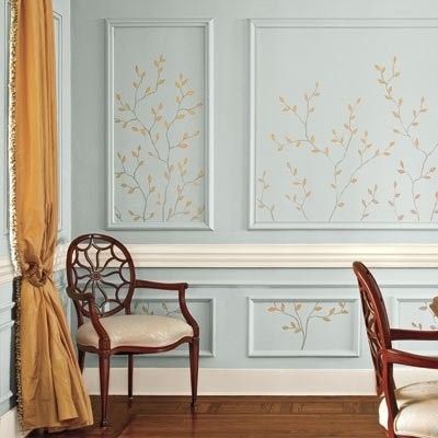 a dining room table and chairs in front of a wall