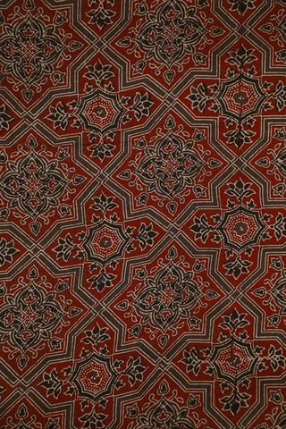 a red and black pattern on fabric