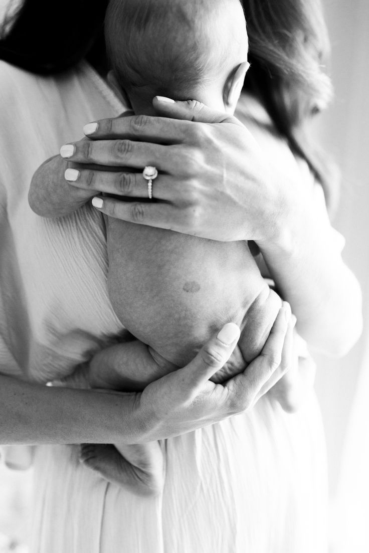 a woman holding a baby in her arms