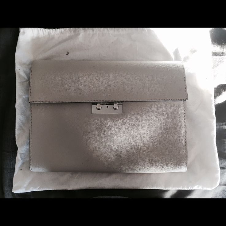 Bally Light Gray Briefcase Clutch Bag Attach Attach Style Men's Clutch /Business Portfolio Briefcase Color: Light Gray Grey Leather With Silver Hardware Comes With Key And Key Case/Strap For The Hardware. Measurements Are Approx: 13" X 10" X 2" Inches Made In Italy! Brand New Never Used! In Excellent Condition! Comes With Original Bally Dust Bag Too Elegant Travel Briefcase With Silver-tone Hardware, Luxury Pouch Clutch With Silver-tone Hardware, Classic Business Clutch With Palladium Hardware, Luxury Clutch With Silver-tone Hardware And Top Handle, Luxury Clutch With Silver-tone Hardware, Elegant Rectangular Briefcase With Silver-tone Hardware, Designer Rectangular Clutch For Everyday Luxury, Designer Everyday Luxury Rectangular Clutch, Luxury Business Shoulder Bag Clutch