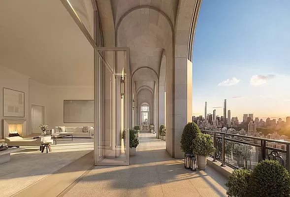 an open balcony overlooking the city skyline at sunset