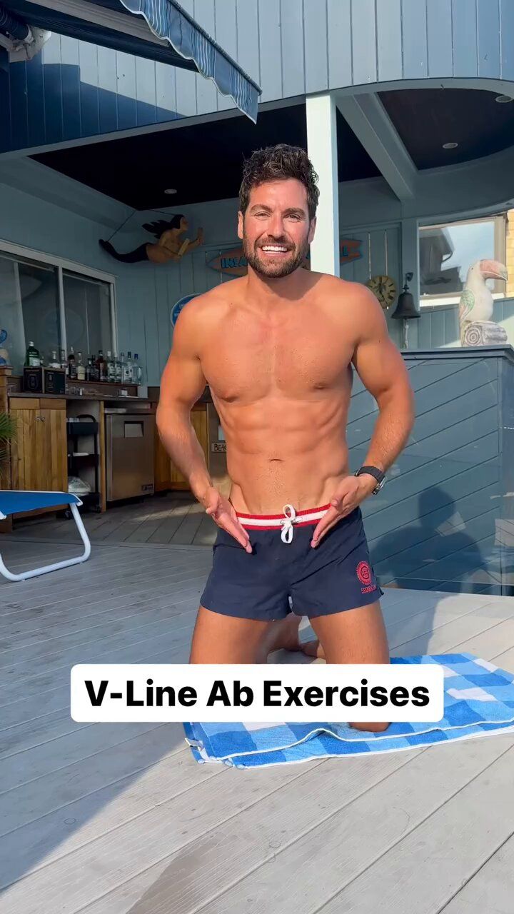 a shirtless man standing on a deck with his hands in his pockets and the words v - line ab exercises