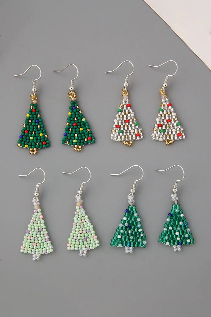 Beaded Christmas Tree Earrings Celebrate the festive season with these charming Beaded Christmas Tree Earrings! These delightful earrings are the perfect accessory to add a touch of holiday cheer to your ensemble. Key Features: Material: High-quality beads meticulously crafted to resemble a miniature Christmas tree. Dimensions: Each earring measures 2 inches in height and 0.67 inches in width, making them a statement piece without being overwhelming. Imported: Elegantly designed and carefully im Beaded Christmas Tree Earrings, Beaded Christmas Tree, Christmas Tree Beads, Teacher Earrings, Tree Earrings, Miniature Christmas Trees, Christmas Tree Earrings, Earring Tree, Miniature Christmas