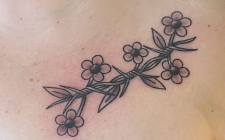 a woman's chest with flowers on it