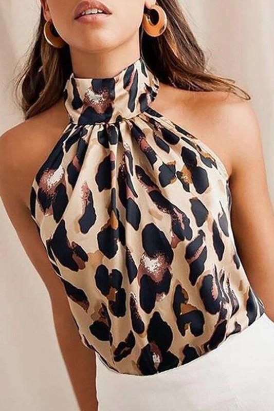 Stunning statement animal print halter neck top. Gorgeous teamed with denim or tailoring for day or night. Sleeveless, halter style top. POLYESTER Mode Prints, Leopard Print Fashion, Halter Blouse, White Shirt Blouse, Women Shirt Top, Leopard Blouse, Leopard Fashion, Womens Tops Summer, Sleeveless Tshirt