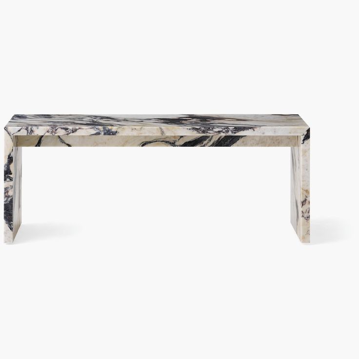 a white marble bench with black and grey veining on the top, against a white background