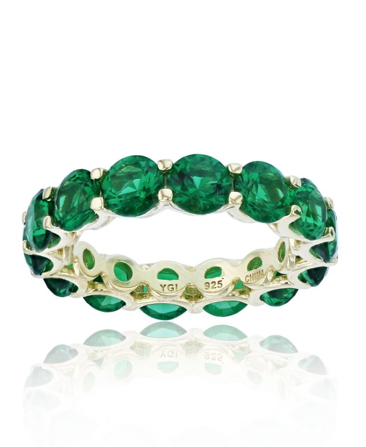 Bold in color, this eternity ring features a paved design with sparkling green cubic zirconias. Elegant Green Eternity Band For May Birthstone, Elegant Green May Birthstone Eternity Band, Macy's Gemstone Jewelry For Anniversary, Macy's Classic Gemstone Jewelry, Macy's Gemstone Jewelry With Round Cut, Macy's Gemstone Jewelry Round Cut, Classic Green Eternity Band, Elegant May Birthstone Eternity Band For Anniversary, Classic Green Round Eternity Band