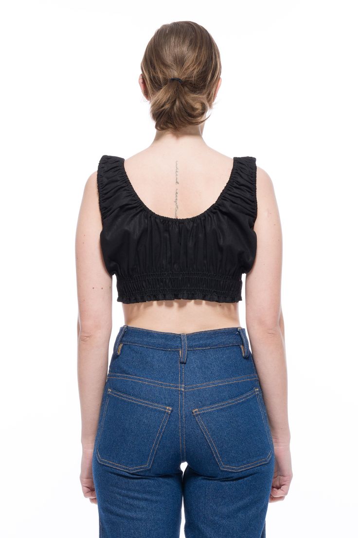 Get ready for summer with this adorable Bella Bralette Top! Featuring a vintage-inspired design, this little bralette pairs perfectly with skirts, denim, and trousers. The elastic neckline and armholes, along with smocking under the bust, make it a comfortable fit for everyone. Available in White, Black, and playful Pink and Blue Gingham patterns. Stretch Ruffled Cropped Crop Top, Stretch Ruffled Crop Top, Stretch Crop Top With Ruffles, Fitted Smocked Bodice Trendy Crop Top, Fitted Smocked Bodice Crop Top, Trendy Fitted Crop Top With Smocked Bodice, Chic Cotton Crop Top With Ruffles, Fitted Bra Friendly Crop Top For Day Out, Fitted Crop Top For Day Out, Bra Friendly