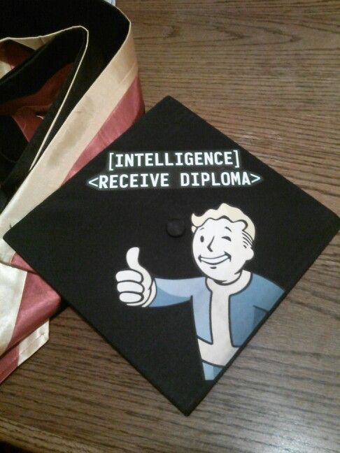 a graduation cap with an image of a man giving the thumbs up sign on it