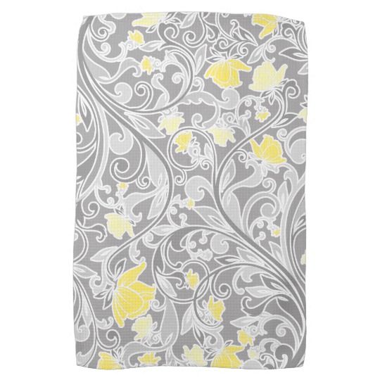 a gray and yellow towel with flowers on it