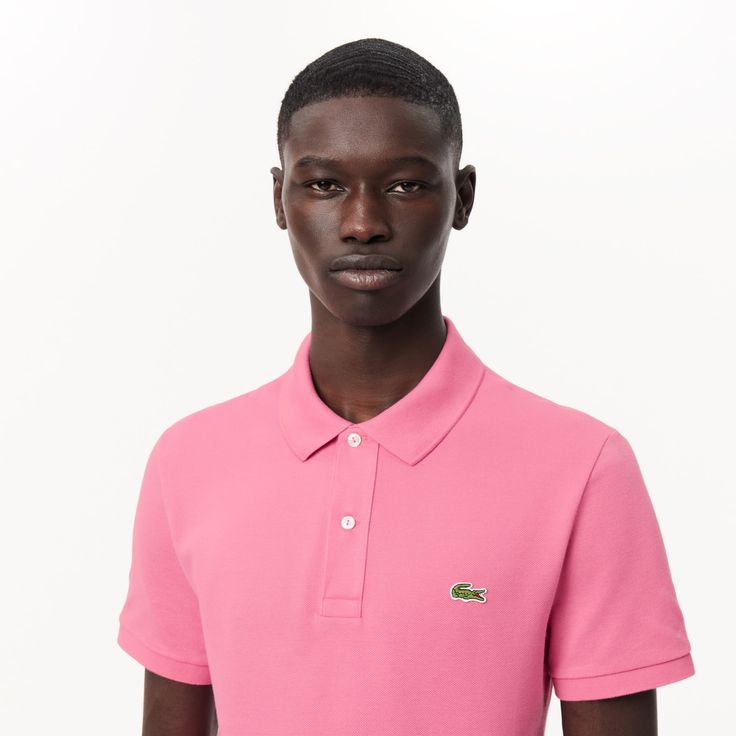 Lacoste upped the stakes in elegant sportswear game with the invention of the polo shirt in 1933. The Original L.12.12, featuring a collar, a button band and a new knit fabric, was born. The historic slim fit design features a fitted cut. Made from over 12 miles of thread, with an embroidered crocodile made up of 2367 stitches… a lesson in expertise. Classic Pink Top With Ribbed Collar, Classic Polo Shirt With Ribbed Collar For Golf, Classic Golf Polo Shirt With Ribbed Collar, Fitted Polo Shirt With Ribbed Collar For Golf, Classic Fitted Pink Polo Shirt, Classic Fitted Polo Shirt With Spread Collar, Classic Fitted Polo Shirt With Ribbed Collar, Classic Fitted Collared Polo Shirt, Classic Polo Shirt With Seamless Collar For Golf