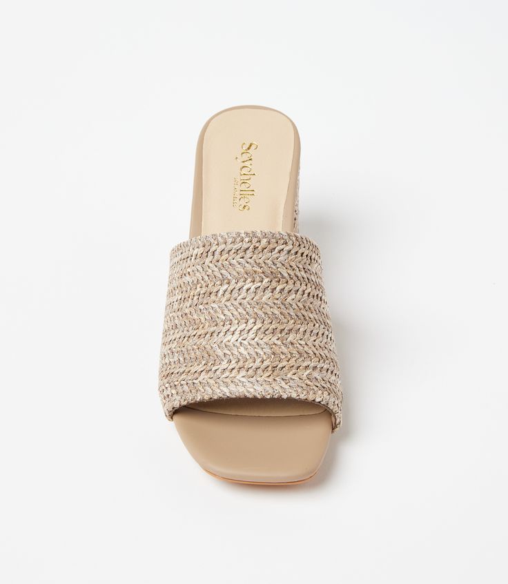 Conquer your day with ease with these raffia slides that strike the perfect balance between a walkable heel height and on-trend style. This design features padded OrthoLite Hybrid insoles and a patented down curve, ensuring a natural and comfortable stride with arch support. The raffia material adds a hint of texture and a bohemian charm, making these sandals a versatile addition to your wardrobe. Raffia upper Heel height: 2 3/4 inches Imported True to size Seychelles | Karen Kane Adapt Raffia H Summer Slip-on Sandals With Padded Heel, Trendy Beach Mules With Padded Heel, Summer Flat Mules With Padded Heel, Summer Slip-on Mules With Wedge Heel, Summer Beach Mules With Padded Heel, Beige Slip-on Slides For Spring, Spring Beige Slip-on Slides, Summer Mules With Woven Sole, Summer Beach Slides With Padded Heel