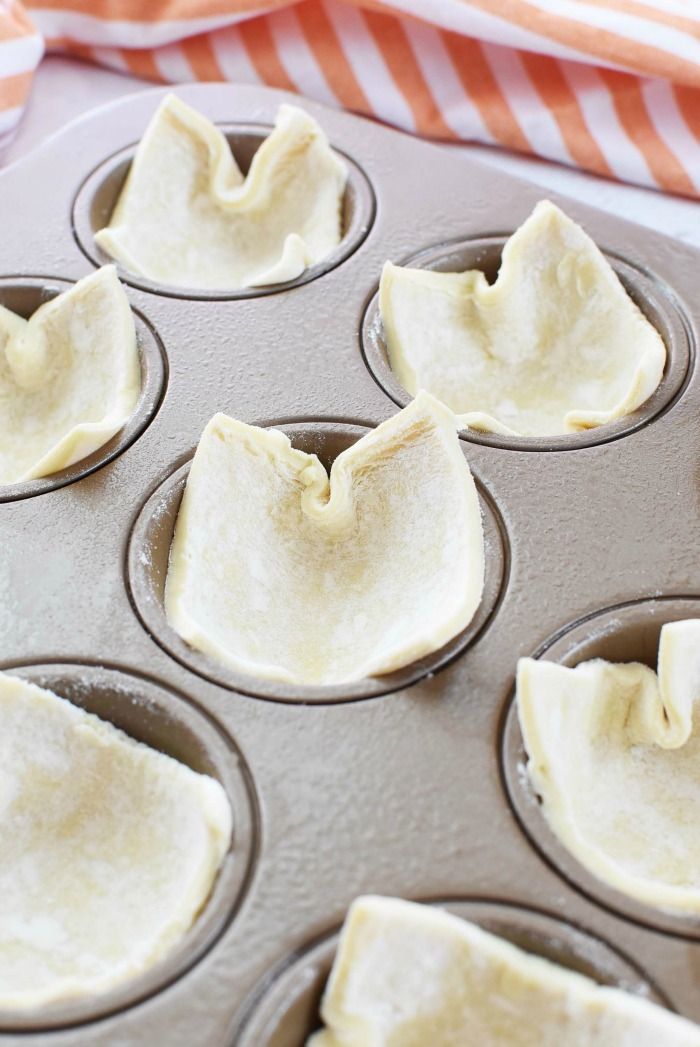 cupcake batter in a muffin tin ready to go into the oven for baking