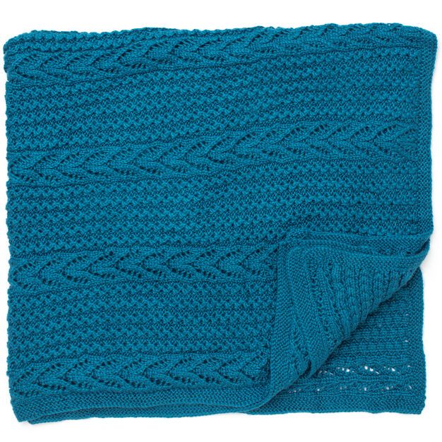 a blue knitted blanket on a white background