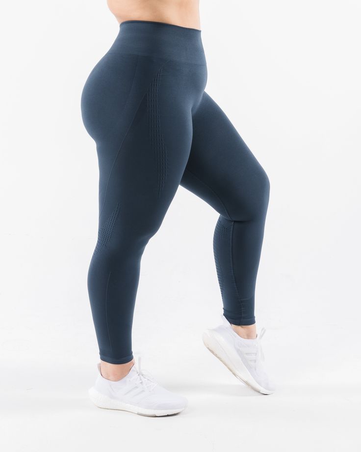 HIGHLIGHTS. High-waisted legging 3-tiered tapered waistband Seamless knit fabric No front seam Back scrunch seam detail to enhance curves New leg and glute contouring panels 26" inseam FIT SUGGESTION. This item runs true to Alphalete's standard seamless fit.. We recommend sizing up for a comfortable fit.. Bailey is 5’4”/162.5cm, wearing a size S with 39.5"/100.3cm hips and 26”/66cm waist. Hannah is 5'11"/180.4cm, wearing a size L with 51.5"/130.8cm hips and 35.5"/90.2cm waist. MATERIALS AND WASH High Waist Seamless Sculpting Activewear, Seamless Sculpting High Waist Activewear, Seamless Sculpting High-waist Activewear, Solid Sculpting Seamless Tights, Sculpting Seamless Solid Tights, Sculpting Seamless Solid Color Tights, Sculpting Solid Seamless Tights, Seamless Sculpting Leggings For Athleisure, Sports Yoga Pants With Seamless Sculpting Fit