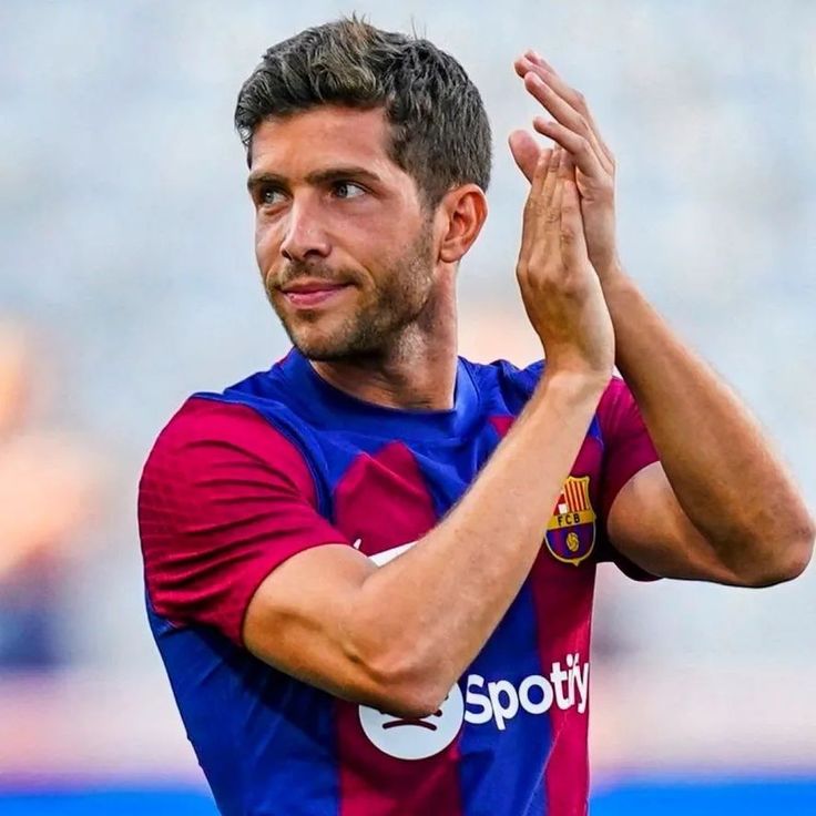 the soccer player is applauding his team's efforts to win the game