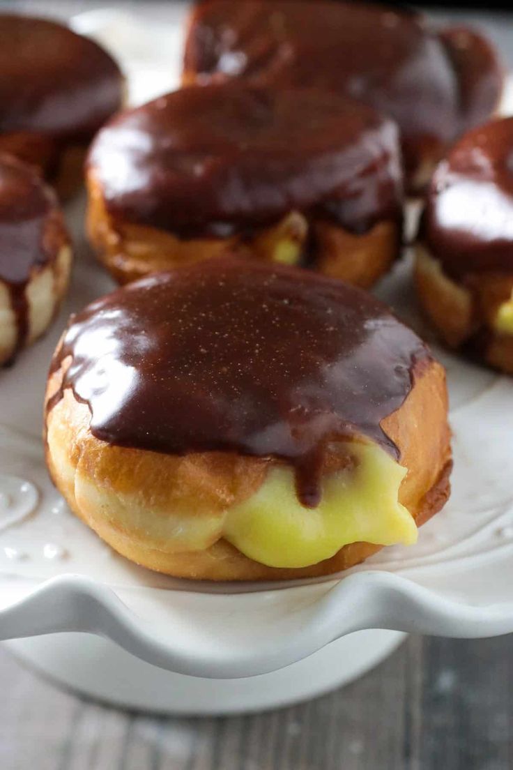 chocolate covered donuts on a white plate