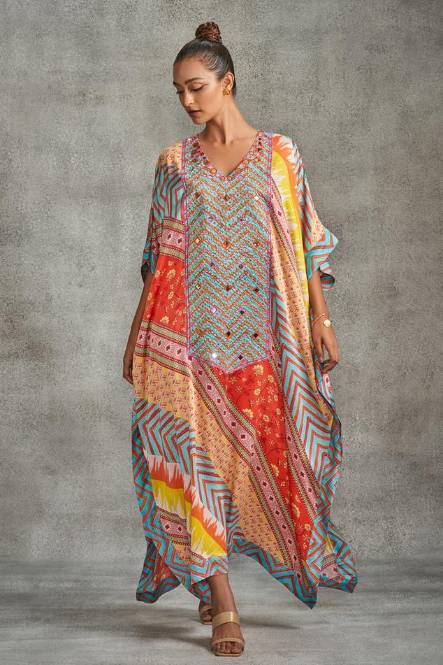 Multi colored kaftan with tribal, abstract, floral and chevron prints all-over and embroidered bodice panel.
Components: 1
Pattern: Printed, Embroidered
Type Of Work: Tribal
Neckline: V Neck
Sleeve Type: Batwing
Fabric: Modal Satin
Color: Multi Color
Occasion: Resort - Aza Fashions Bohemian Multicolor Print V-neck Kaftan, Bohemian Kaftan With Printed Motifs For Festive Occasions, Multicolor Printed V-neck Kaftan, Multicolor V-neck Kaftan With Printed Motifs, Navratri Silk Kaftan With Printed Motifs, Bohemian Kaftan For Festive Occasions, Multicolor V-neck Dress For Navratri, Bohemian Kaftan With Printed Motifs For Festivals, Bohemian Kaftan For Navratri With Printed Motifs