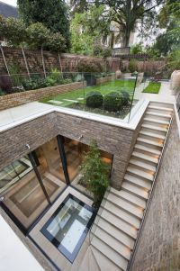 an aerial view of a house with stairs leading up to the second floor and garden area