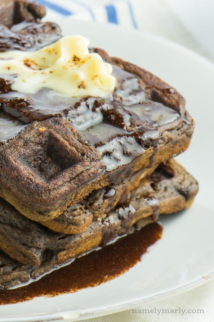 a stack of chocolate waffles with ice cream on top