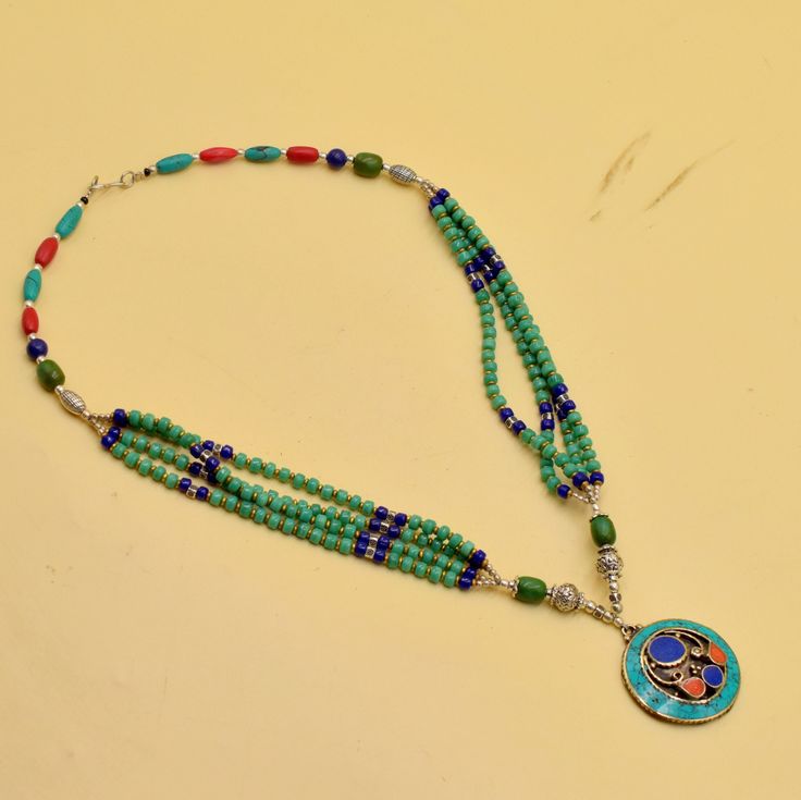 A very beautiful ethnic Necklace, it was handcrafted in Nepal. The design is inspired by traditional Nepalese pattern. The stones used for its manufacture are: Turquoise, Coral, Lapis Lazuli. Our products are totally handmade and made with high quality gemstones  If you believe in buying top quality products for yourself and for your family and friends,  Silverism is the place where you want to be There are unique pieces,  handcrafted to perfection with brilliant gem stones set in modern and traditional designs. We have jewelry for everyone,  Our collection also has some fabulous gifting ideas and we will gift wrap it specially for your special one too. Silverism brings you the widest array of jewelry at price points that will bowl you over. MESSAGE US FOR WHOLESALE PRICE ABOUT NEPALESE TI Festive Turquoise Necklaces With Colorful Beads, Traditional Handmade Turquoise Beaded Necklaces, Bohemian Turquoise Beaded Necklaces For Festive Occasions, Traditional Handmade Beads For Festive Occasions, Handmade Traditional Beads For Festive Occasions, Bohemian Style Turquoise Beaded Necklace For Festive Occasions, Traditional Handmade Festive Beads, Traditional Handmade Turquoise Beads, Traditional Silver Turquoise Round Beads Necklace