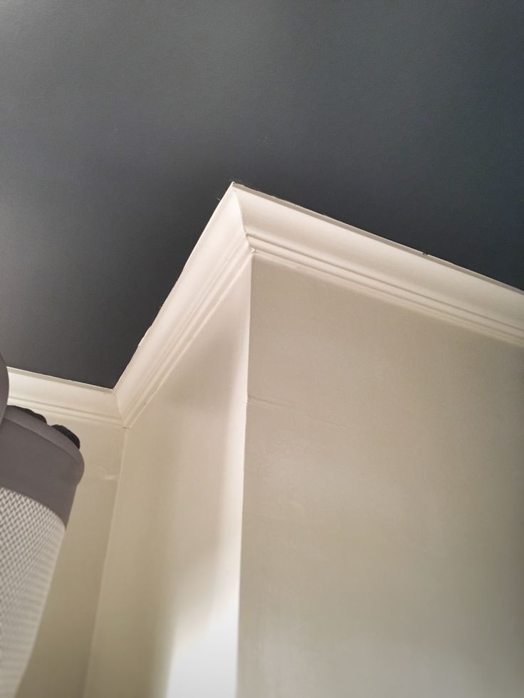 the corner of a room with a light fixture