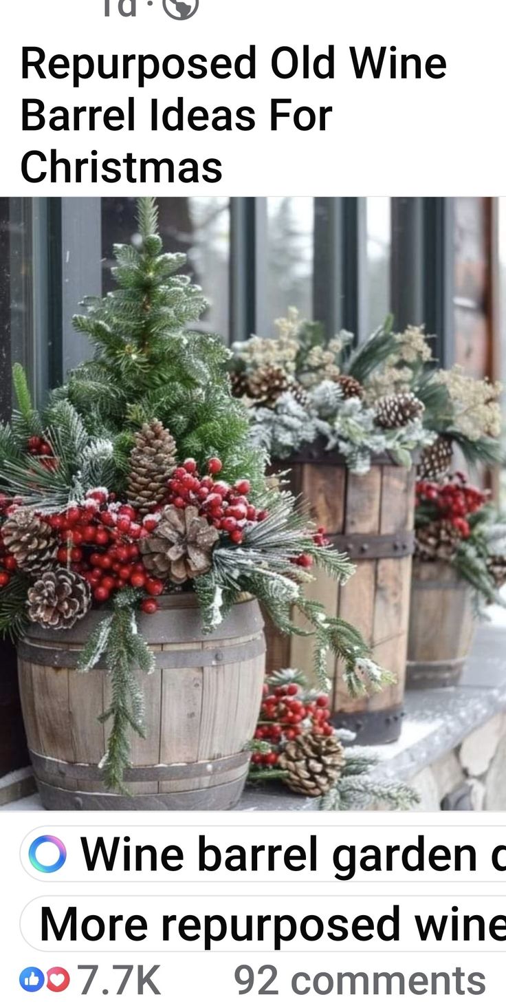 wine barrel christmas trees with red berries and pine cones in them are on the porch