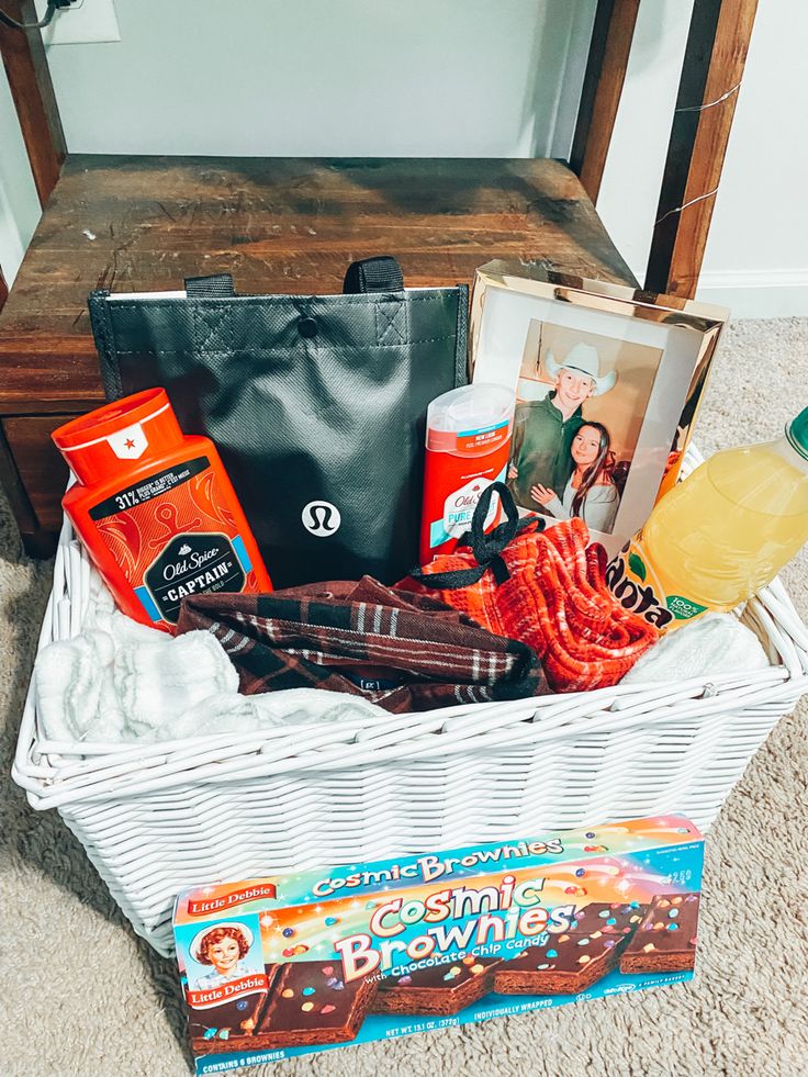 a white basket filled with items on top of a carpeted floor next to a wooden table