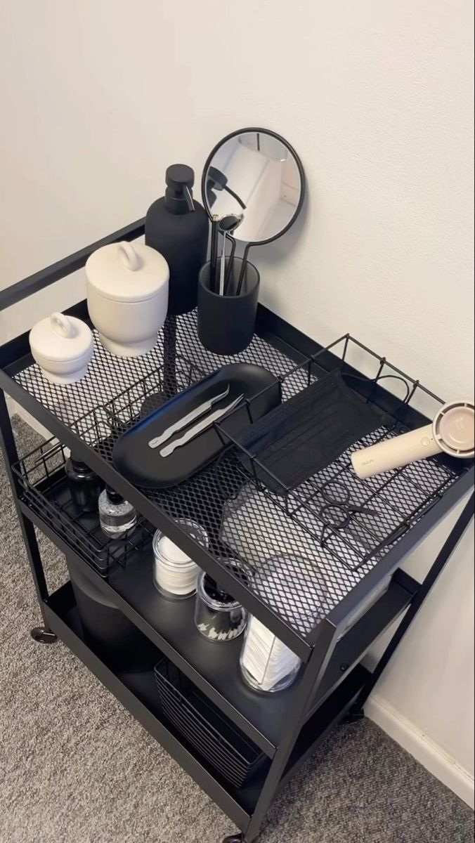 a kitchen cart with utensils on top of it