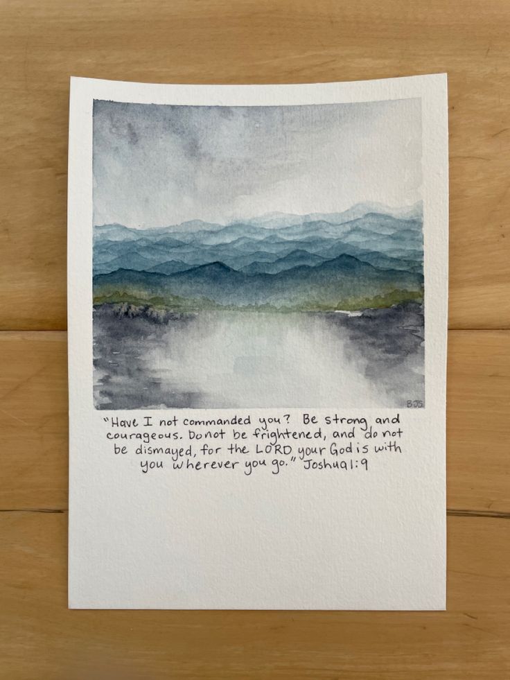 a card with an image of mountains and the words, you are surrounded by clouds